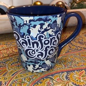 Perfect condition Rainforest Cafe coffee mug with raised lettering.